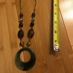 Green bead necklace with medallion